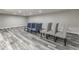 The basement features wood plank flooring with grey painted walls and recessed lighting at 2502 Colinbrook Pkwy, Greenwood, IN 46143