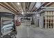 Spacious unfinished basement offers potential for customization with exposed ceiling and visible mechanical systems at 2502 Colinbrook Pkwy, Greenwood, IN 46143