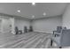 Basement showcasing plank flooring, recessed lights, and neutral paint color at 2502 Colinbrook Pkwy, Greenwood, IN 46143