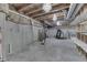 Unfinished basement area featuring an exposed ceiling, concrete walls and crystal chandeliers at 2502 Colinbrook Pkwy, Greenwood, IN 46143