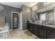 This primary bathroom features a double sink vanity and a standalone soaking tub at 2502 Colinbrook Pkwy, Greenwood, IN 46143
