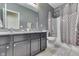 A full bathroom featuring dual sinks, a shower/tub combo, and modern fixtures at 2502 Colinbrook Pkwy, Greenwood, IN 46143