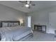 A comfortable bedroom featuring a bed, fan and ample natural light at 2502 Colinbrook Pkwy, Greenwood, IN 46143