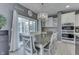 Bright breakfast nook with large windows and a stylish chandelier, perfect for everyday meals at 2502 Colinbrook Pkwy, Greenwood, IN 46143