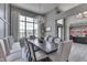 Spacious dining area with contemporary lighting, gray walls, and large window overlooking the yard at 2502 Colinbrook Pkwy, Greenwood, IN 46143