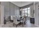 Elegant dining room with modern chandelier, stylish wainscoting, and large windows for natural light at 2502 Colinbrook Pkwy, Greenwood, IN 46143