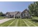Attractive brick home featuring manicured lawn, tidy shrubbery, and symmetrically placed windows at 2502 Colinbrook Pkwy, Greenwood, IN 46143