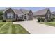 Charming brick home featuring an attached garage, lush landscaping, and an inviting curb appeal at 2502 Colinbrook Pkwy, Greenwood, IN 46143