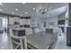 Bright open kitchen and dining area with granite countertops, stainless appliances, and elegant lighting at 2502 Colinbrook Pkwy, Greenwood, IN 46143