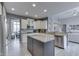 Open kitchen and dining area boasts stainless appliances, granite countertops, and bright lighting at 2502 Colinbrook Pkwy, Greenwood, IN 46143