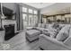 Open-concept living room with a fireplace seamlessly flowing into the kitchen area at 2502 Colinbrook Pkwy, Greenwood, IN 46143