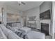 Cozy living room with a fireplace, comfortable seating, and a view of the upper floor and entryway at 2502 Colinbrook Pkwy, Greenwood, IN 46143