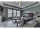 Spacious main bedroom with tray ceilings, ample natural light, and decorative ceiling fan at 2502 Colinbrook Pkwy, Greenwood, IN 46143