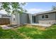Landscaped backyard with a small patio perfect for relaxing, plus a fenced backyard at 2537 N Boehning St, Indianapolis, IN 46219