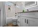 Renovated bathroom with new vanity, new toilet, new tub with shower, and new tiles at 2537 N Boehning St, Indianapolis, IN 46219