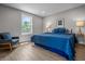 Cozy bedroom with modern decor, a large window, and neutral colored walls providing a warm and inviting atmosphere at 2537 N Boehning St, Indianapolis, IN 46219