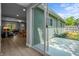 Exterior view of the home with sliding glass doors leading to the backyard at 2537 N Boehning St, Indianapolis, IN 46219