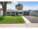Single story home featuring a well-kept lawn, siding, and an attached garage, perfect for first-time homebuyers at 2537 N Boehning St, Indianapolis, IN 46219
