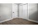 Hallway features two doors and vinyl flooring, with gray wall paint at 2537 N Boehning St, Indianapolis, IN 46219