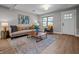 Bright living room with hardwood floors, neutral walls, and stylish furniture, creating a cozy and inviting atmosphere at 2537 N Boehning St, Indianapolis, IN 46219