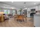 Open concept living and dining area featuring wood floors, recessed lighting, and modern decor perfect for entertaining at 2537 N Boehning St, Indianapolis, IN 46219
