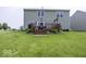 Large backyard with green lawn, wooden deck, and well maintained landscaping for relaxation at 2786 Longleaf Dr, Greenwood, IN 46143