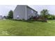Spacious backyard with lush green lawn and a wooden deck perfect for entertaining at 2786 Longleaf Dr, Greenwood, IN 46143