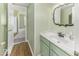 Bathroom features a modern sink with chrome fixtures and green vanity at 2786 Longleaf Dr, Greenwood, IN 46143