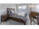 Cozy bedroom with modern decor, bedside tables, a writing desk and a large window at 2786 Longleaf Dr, Greenwood, IN 46143