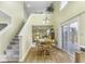 Bright dining area features wood floors, stairs, and glass sliding doors leading to the outdoor deck at 2786 Longleaf Dr, Greenwood, IN 46143
