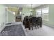Dining area with carpet and a view to the kitchen, perfect for everyday meals at 2786 Longleaf Dr, Greenwood, IN 46143