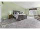 Main bedroom with vaulted ceilings, large bed, and neutral decor at 2786 Longleaf Dr, Greenwood, IN 46143