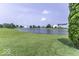Picturesque pond surrounded by green grass offers a tranquil view at 2786 Longleaf Dr, Greenwood, IN 46143