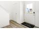 Bright foyer with hardwood floors, white trim, and a view of the front door at 2920 Woods Edge Dr, Greenwood, IN 46143