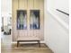 Entryway featuring a wood accent wall, decorative art, and a bench seat at 2920 Woods Edge Dr, Greenwood, IN 46143