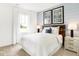 Bright bedroom features a comfortable bed, soothing natural light, and stylish decor at 2946 Woods Edge Dr, Greenwood, IN 46143