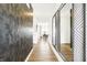 Bright hallway with wood flooring, decorative mirrors, and views of the dining room at 2946 Woods Edge Dr, Greenwood, IN 46143