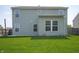 Well-maintained backyard featuring lush green grass, a spacious patio, and partial fencing at 3010 Underwood Ct, Whiteland, IN 46184