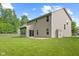 Spacious backyard featuring a well-maintained lawn and a patio area perfect for outdoor entertaining at 3068 Reflection Ct, Greenwood, IN 46143