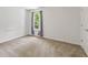 Bright, carpeted bedroom with a large window providing natural light, offering a serene and comfortable living space at 3068 Reflection Ct, Greenwood, IN 46143