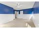Bright bedroom features a neutral carpet, two-tone walls and a ceiling fan, creating a comfortable and inviting atmosphere at 3068 Reflection Ct, Greenwood, IN 46143