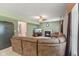 Open concept living area with a fireplace, large sectional sofa, and ample natural light at 3068 Reflection Ct, Greenwood, IN 46143