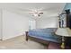 Spacious main bedroom features a ceiling fan, carpet flooring, and ensuite bathroom access at 3068 Reflection Ct, Greenwood, IN 46143