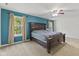 The main bedroom offers plenty of natural light, a ceiling fan, and carpet flooring at 3068 Reflection Ct, Greenwood, IN 46143
