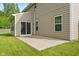 A concrete patio accessible through sliding glass doors connects indoor and outdoor living at 3068 Reflection Ct, Greenwood, IN 46143