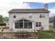 Back exterior view featuring deck, sunroom, play set, and large lot at 3714 Turfway Ct, Indianapolis, IN 46228