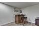 Finished basement features a rustic bar and wooden stools at 3714 Turfway Ct, Indianapolis, IN 46228