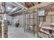 Unfinished basement area with exposed framing, utilities, and wire shelving at 3714 Turfway Ct, Indianapolis, IN 46228