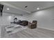 Finished basement features neutral walls and plush seating area at 3714 Turfway Ct, Indianapolis, IN 46228