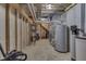 Unfinished basement with water heater, framing, and utilities at 3714 Turfway Ct, Indianapolis, IN 46228